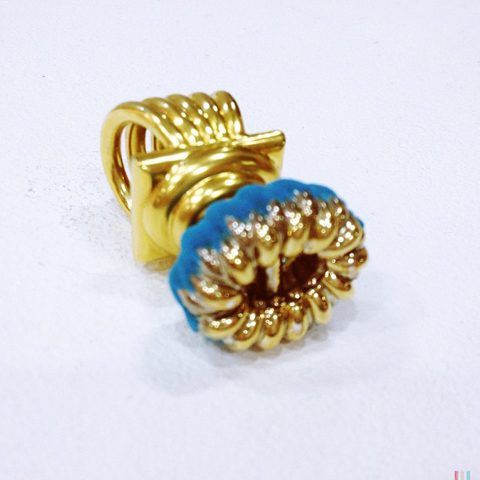 Oversized gold flock ring by Nadia Deen