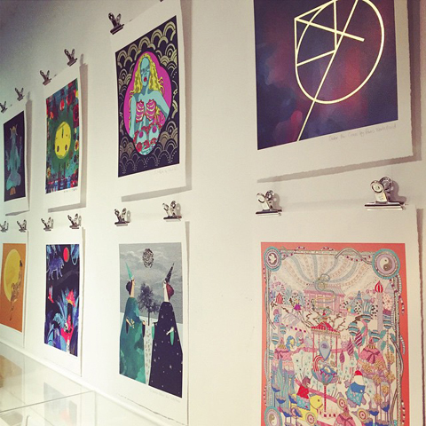 TWWDNU prints on wall at Tatty Devine